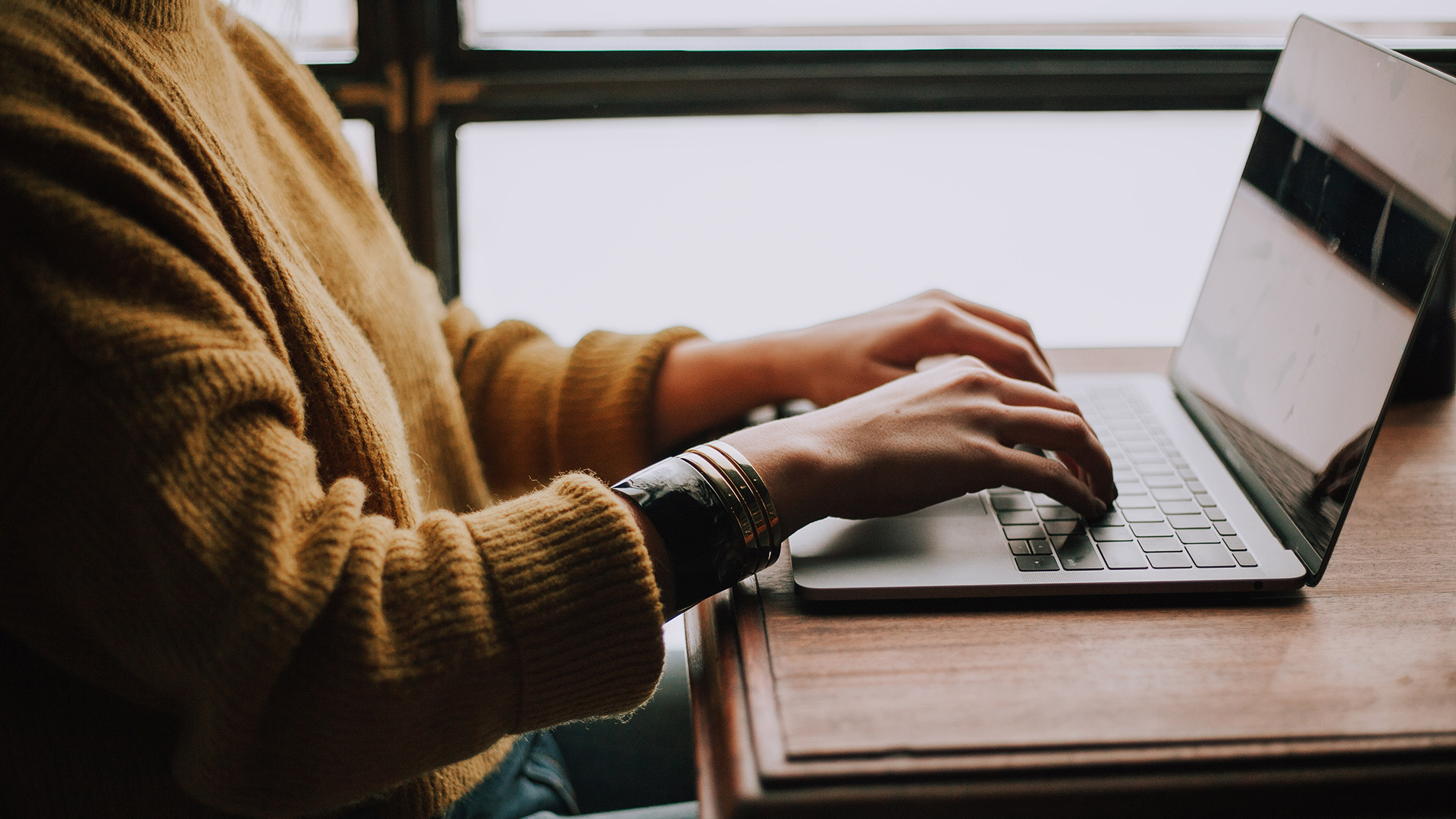 Woman at her computer typing