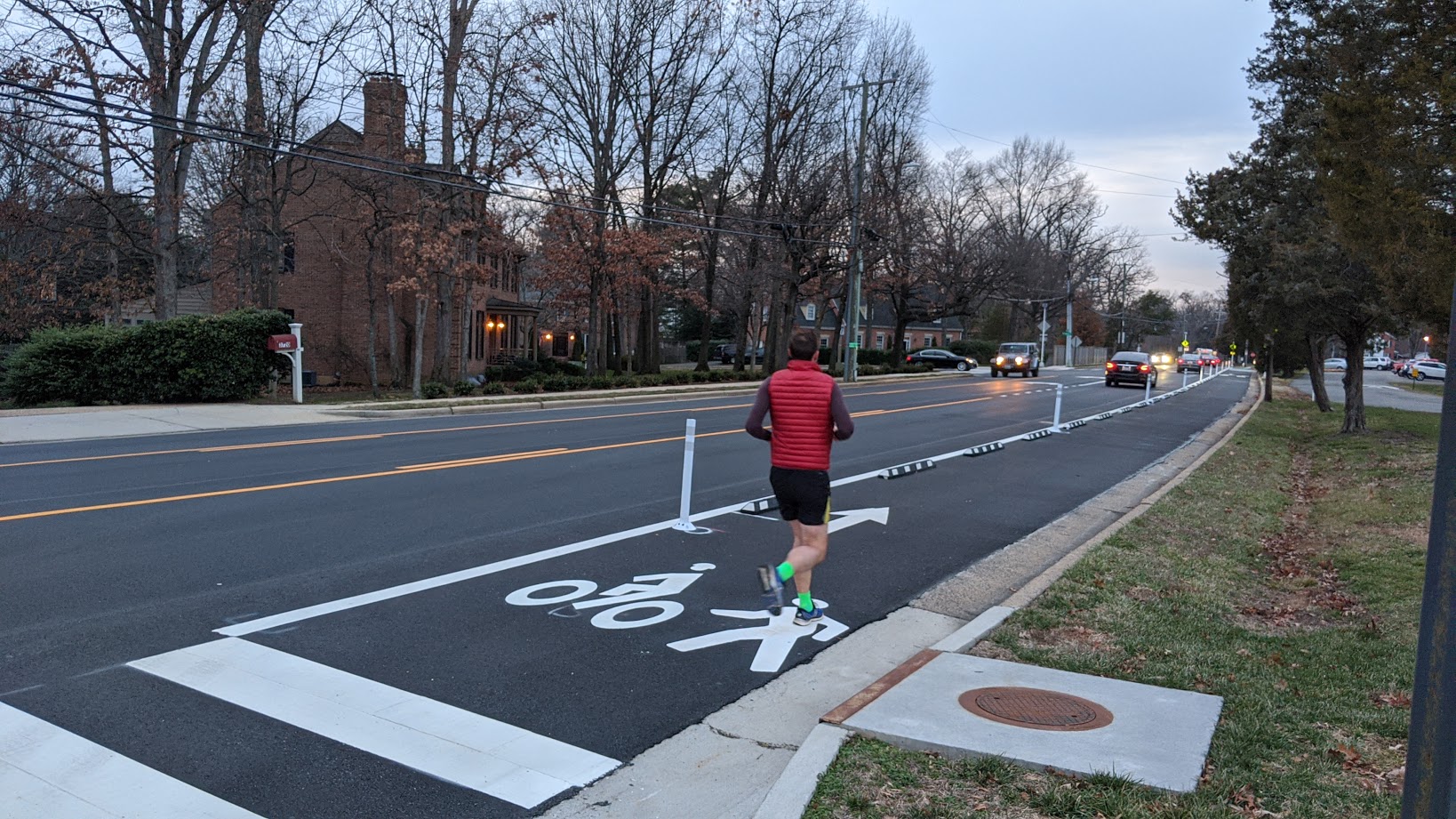 Image of a person jogging in the shared bicycle and pedestrian lane on Seminary Road.