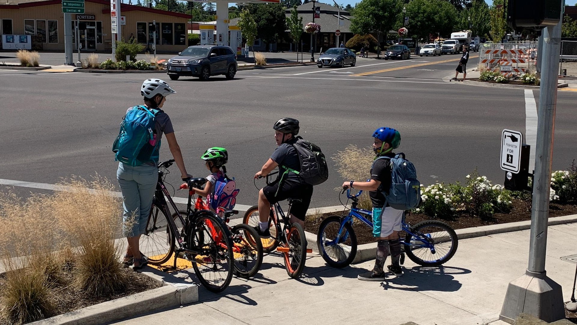 Bicyclists Wait to Cross Intersection