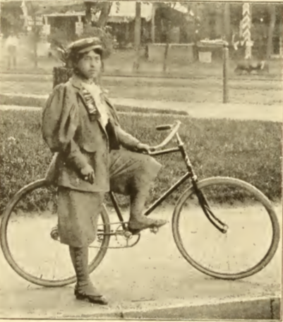 Kittie Knox poses with bicycle