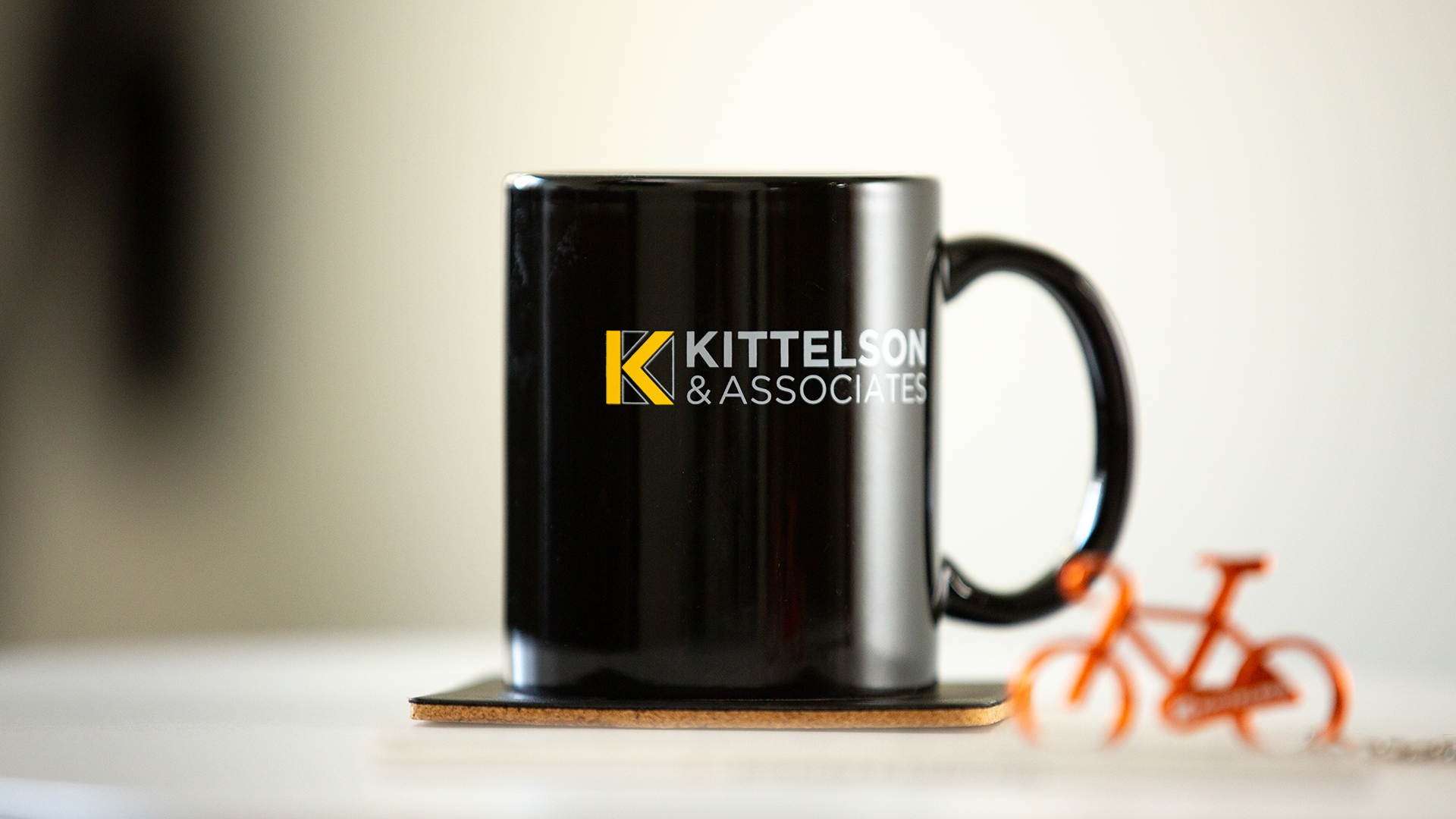 Kittelson coffee mug and bicycle keychain
