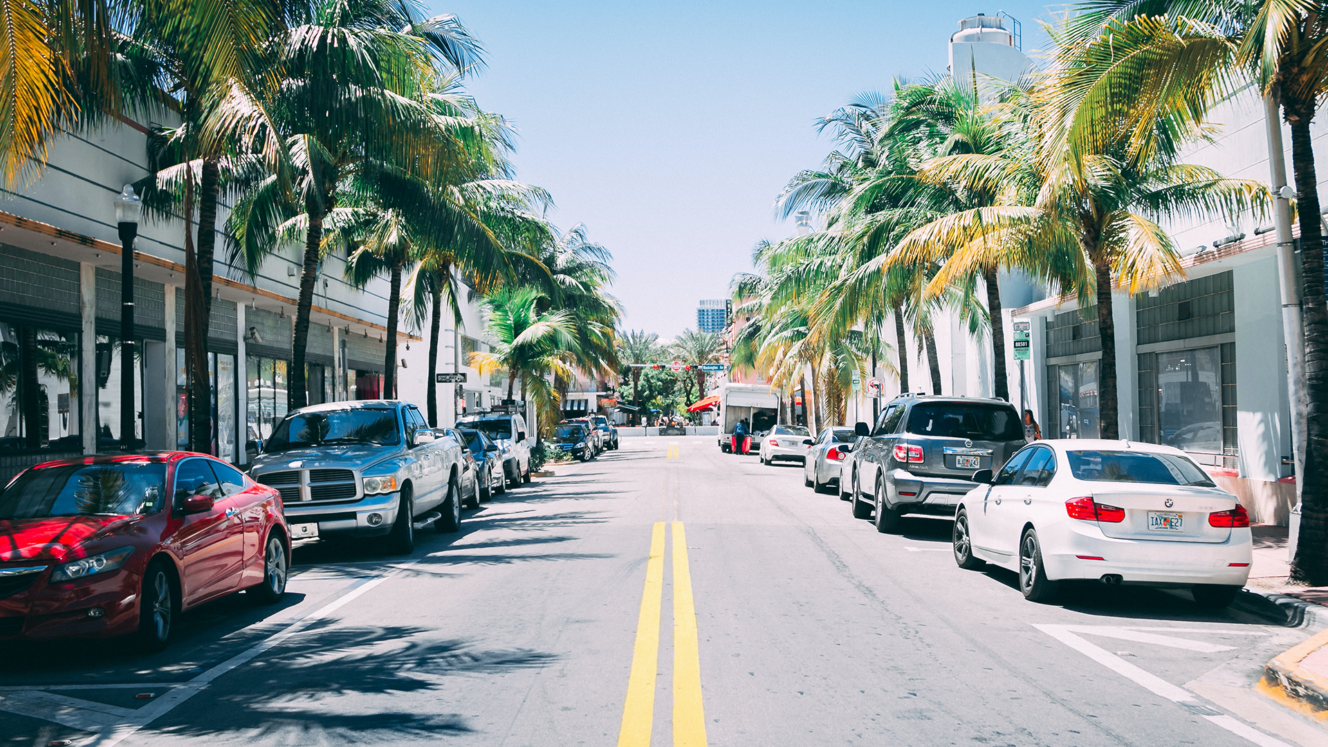 Road with cars parked on the sides in Miami