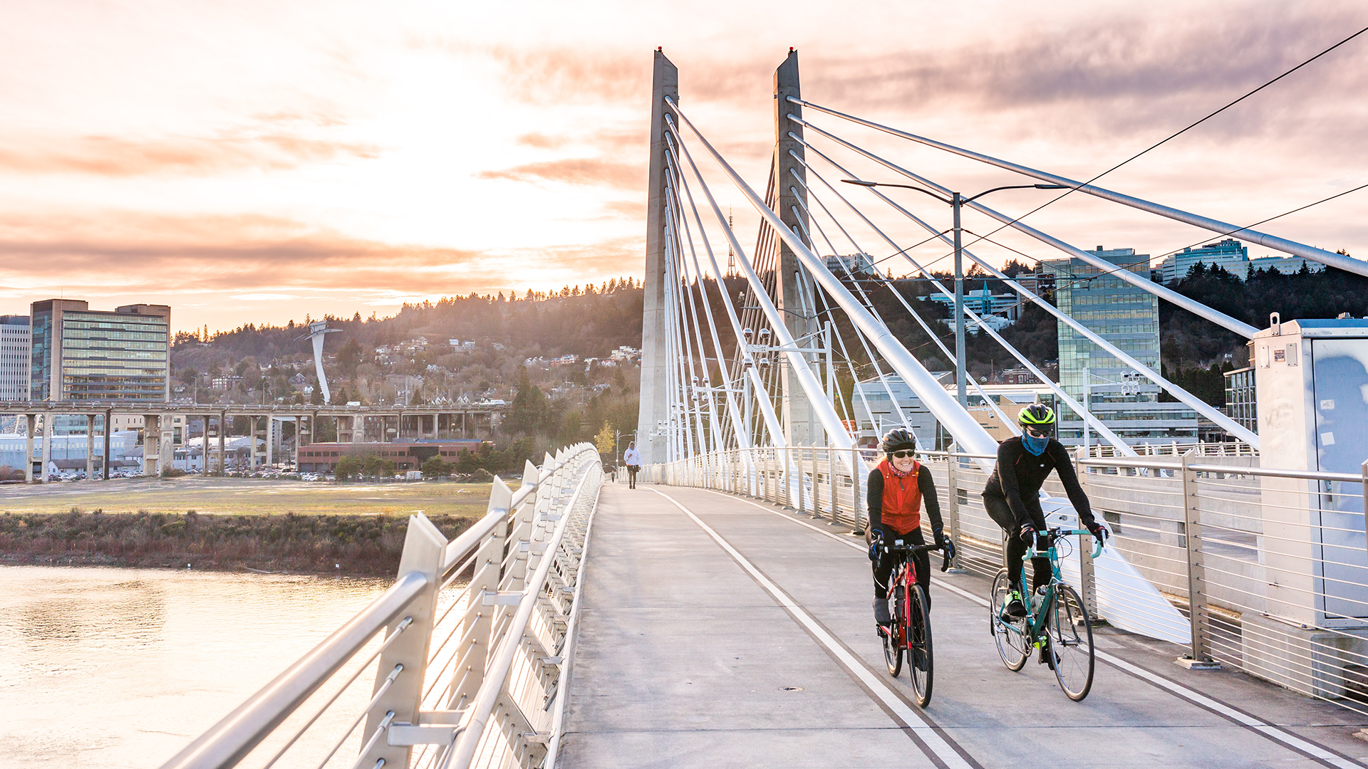 Two bikers on bridge