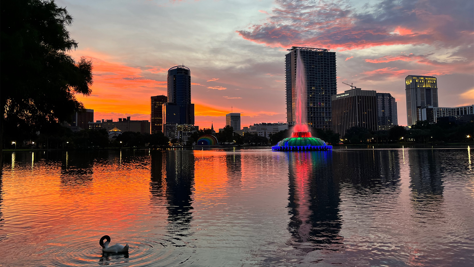 Lake overlooking Orlando skyline during sunset
