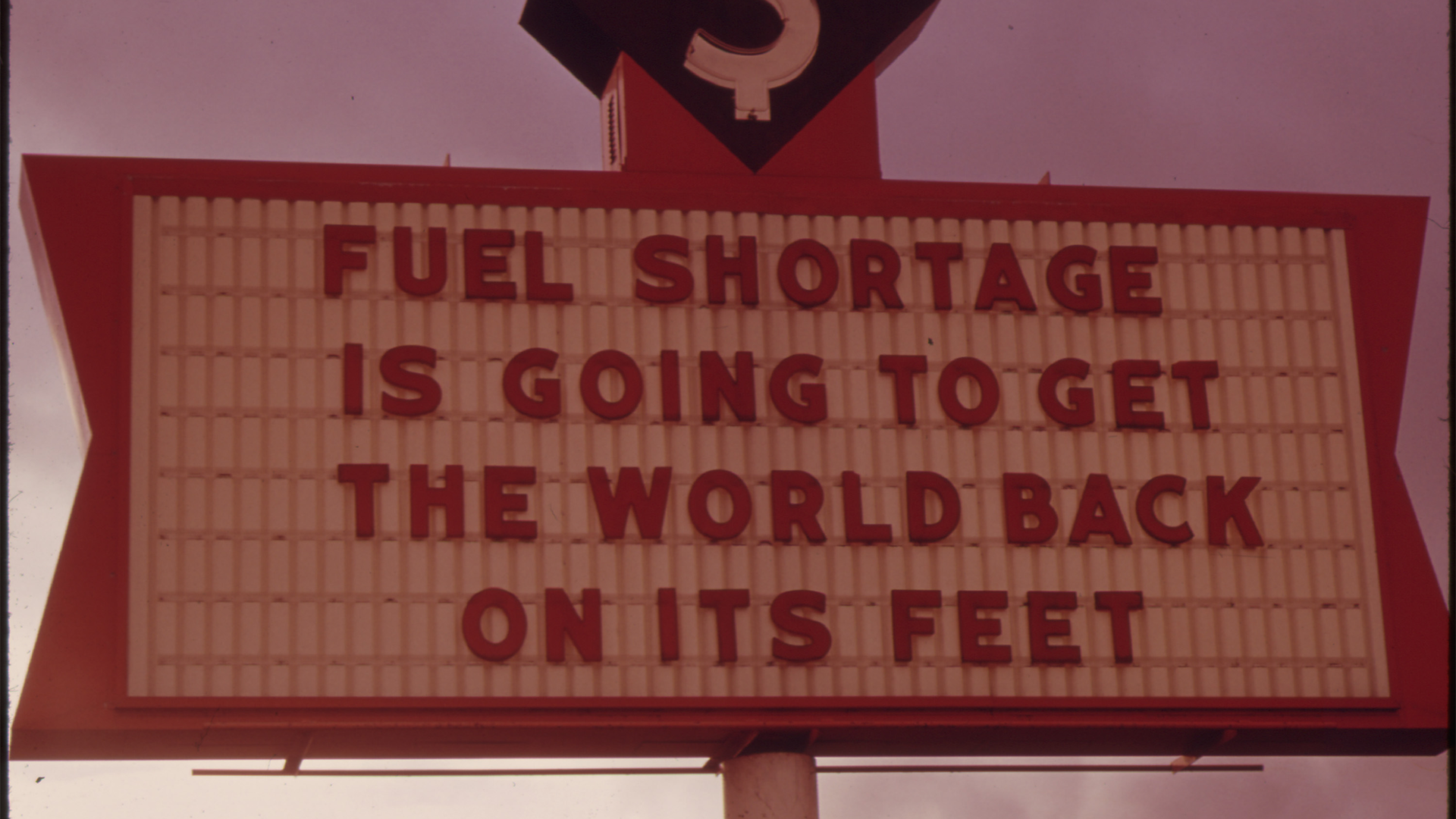 Billboard with text about fuel crisis on it