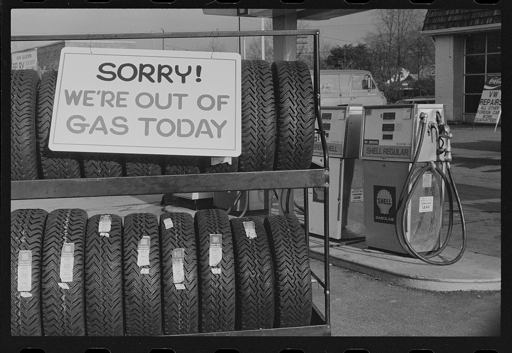 Sign at gas station stating "out of gas"
