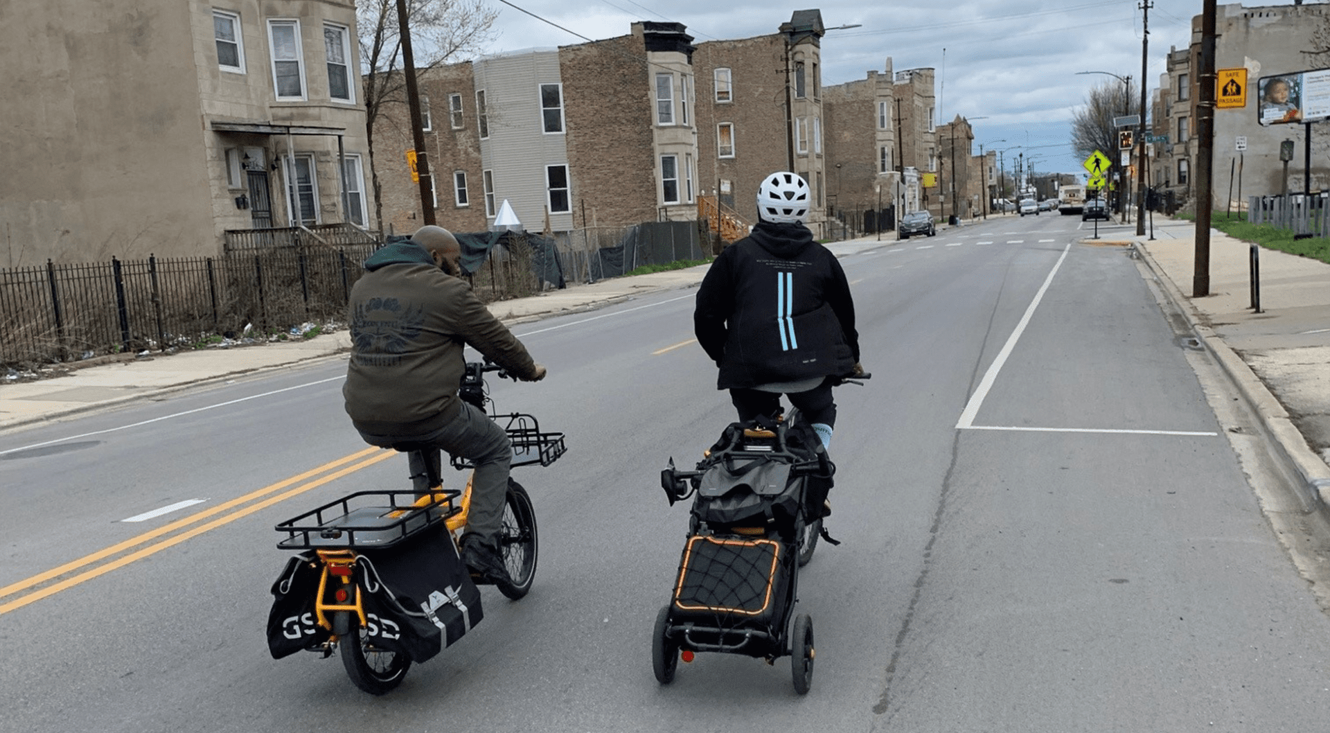 Equiticity members Olatunji Oboi Reed and Derek Brown lead a community bike ride