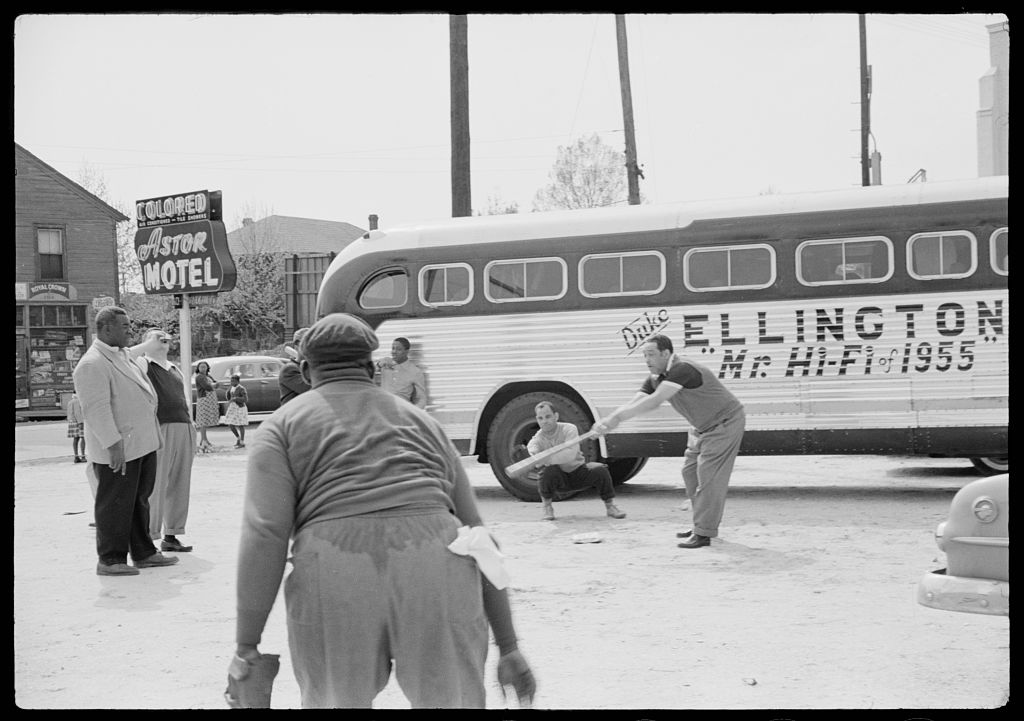 Duke Ellington and his band members play baseball in parking lot