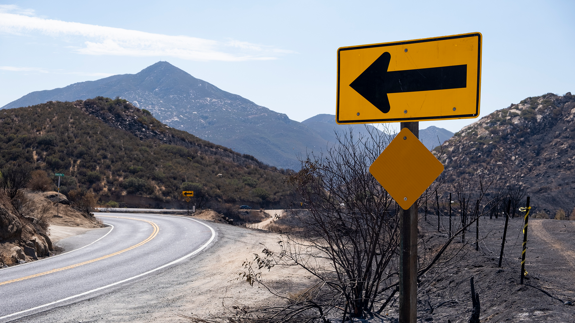 Road sign with left arrow