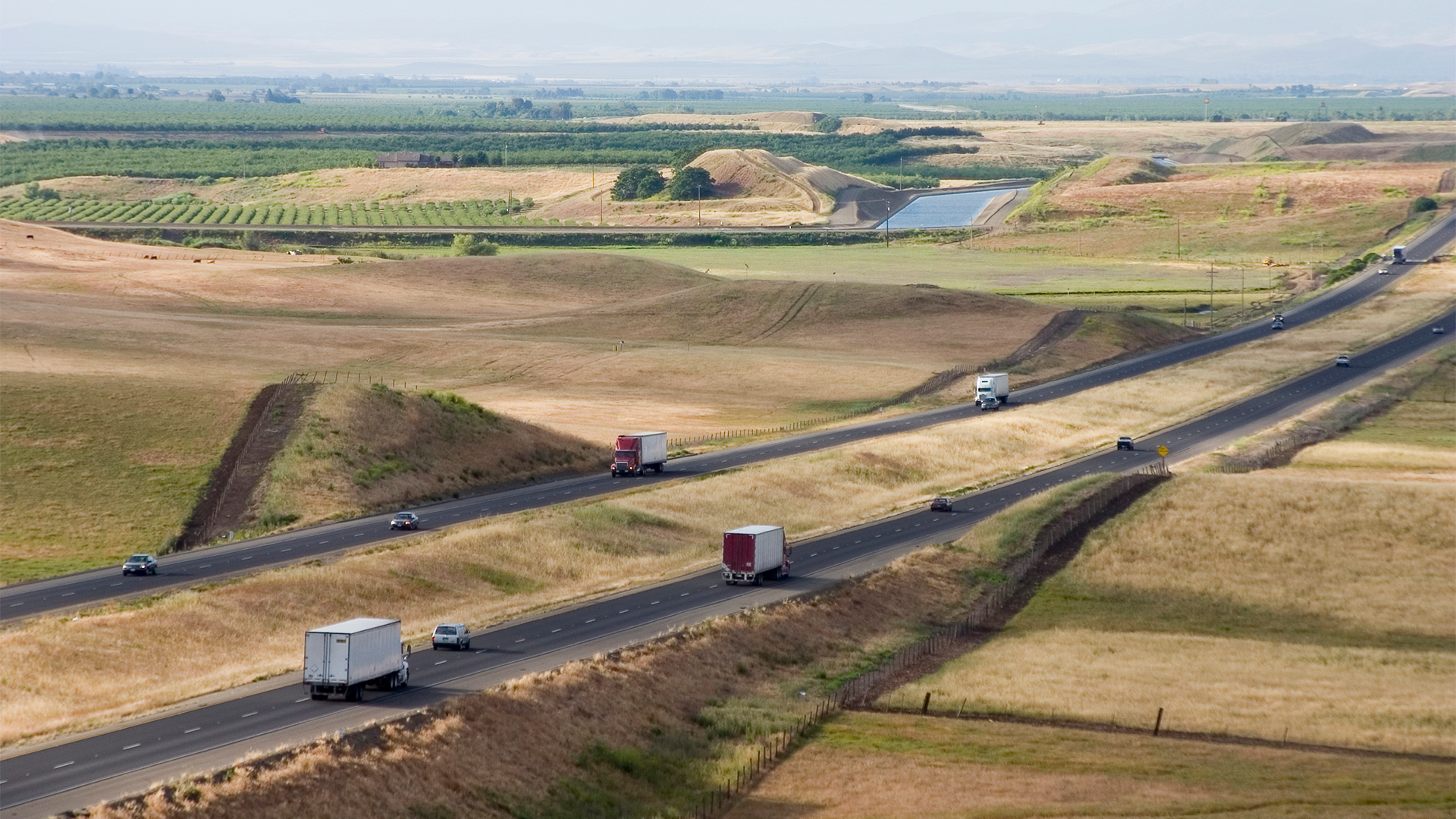 Farm landscape with two highways running through it