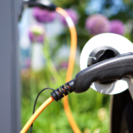 Gas pump in car with greenery in the background