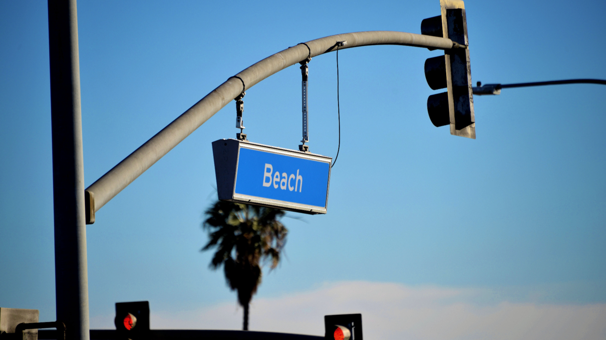 Street sign that says "Beach"