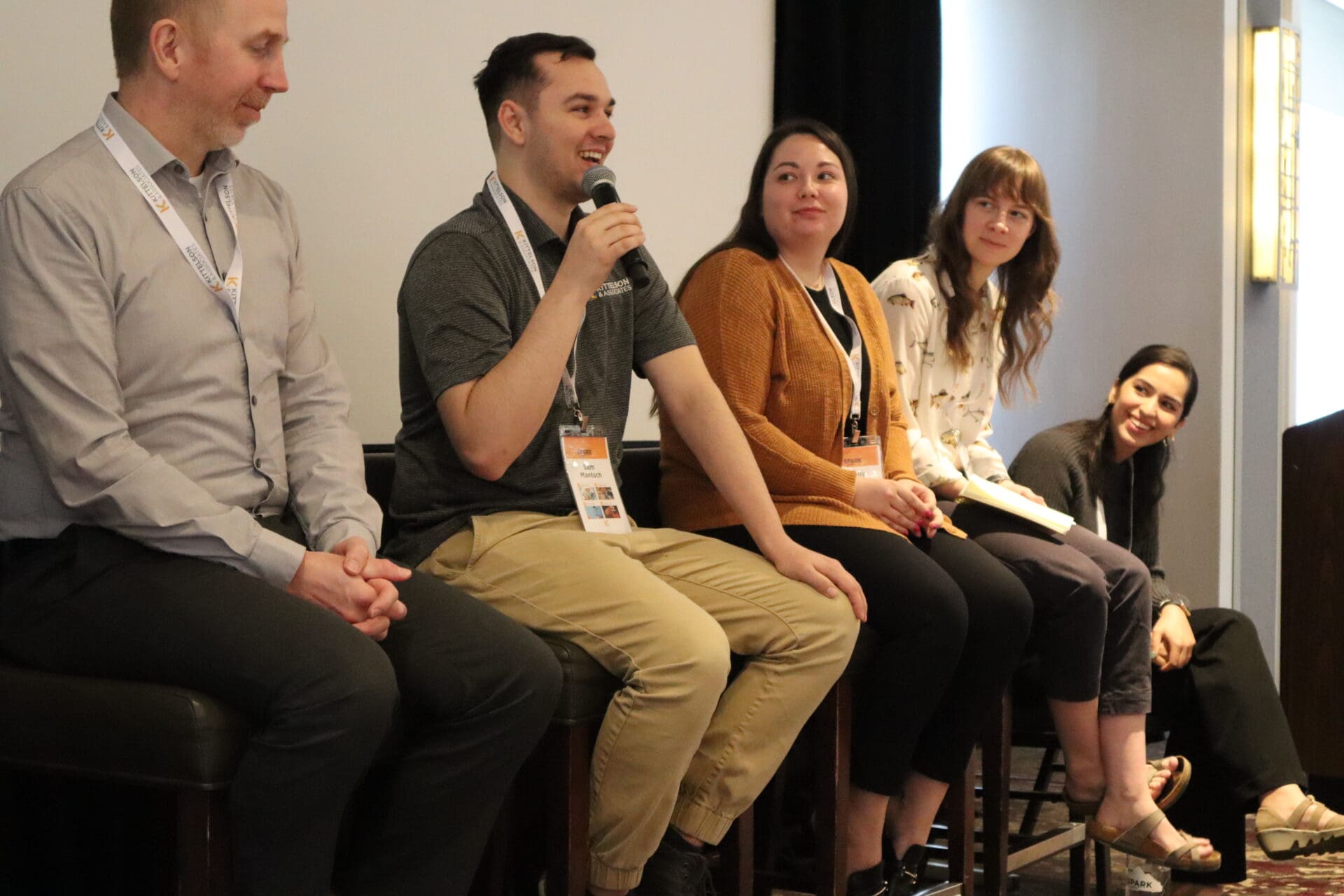 Group of five panelists answering questions.