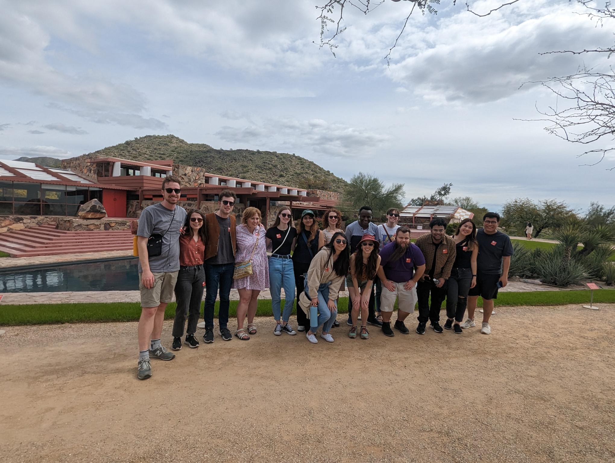 Group photo in front of a Frank Lloyd Wright building.