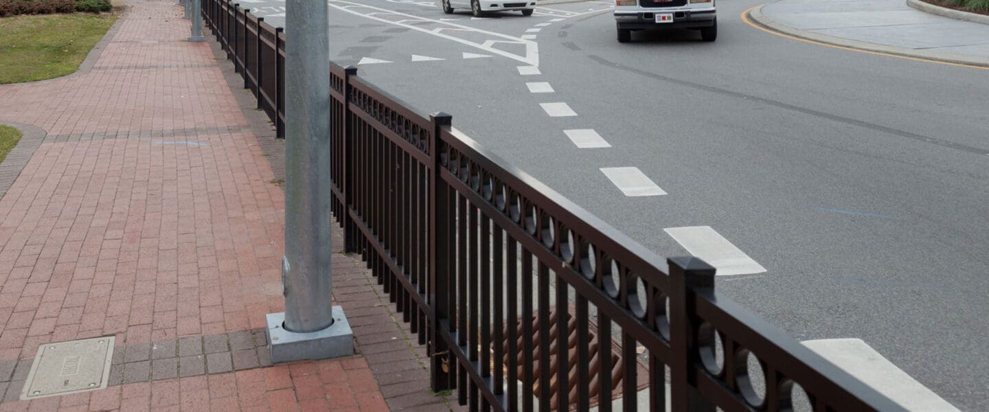 Fence between sidewalk and street at roundabout