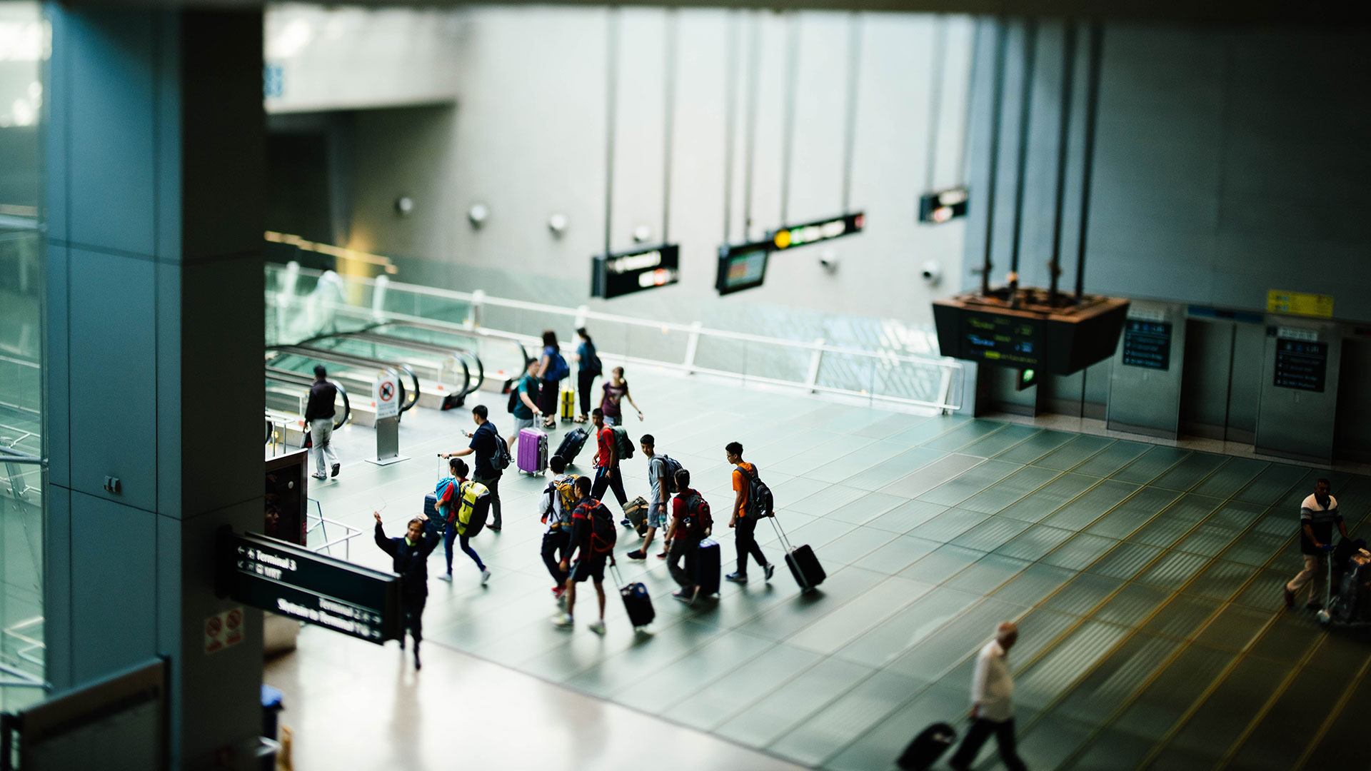 People walking through an airport