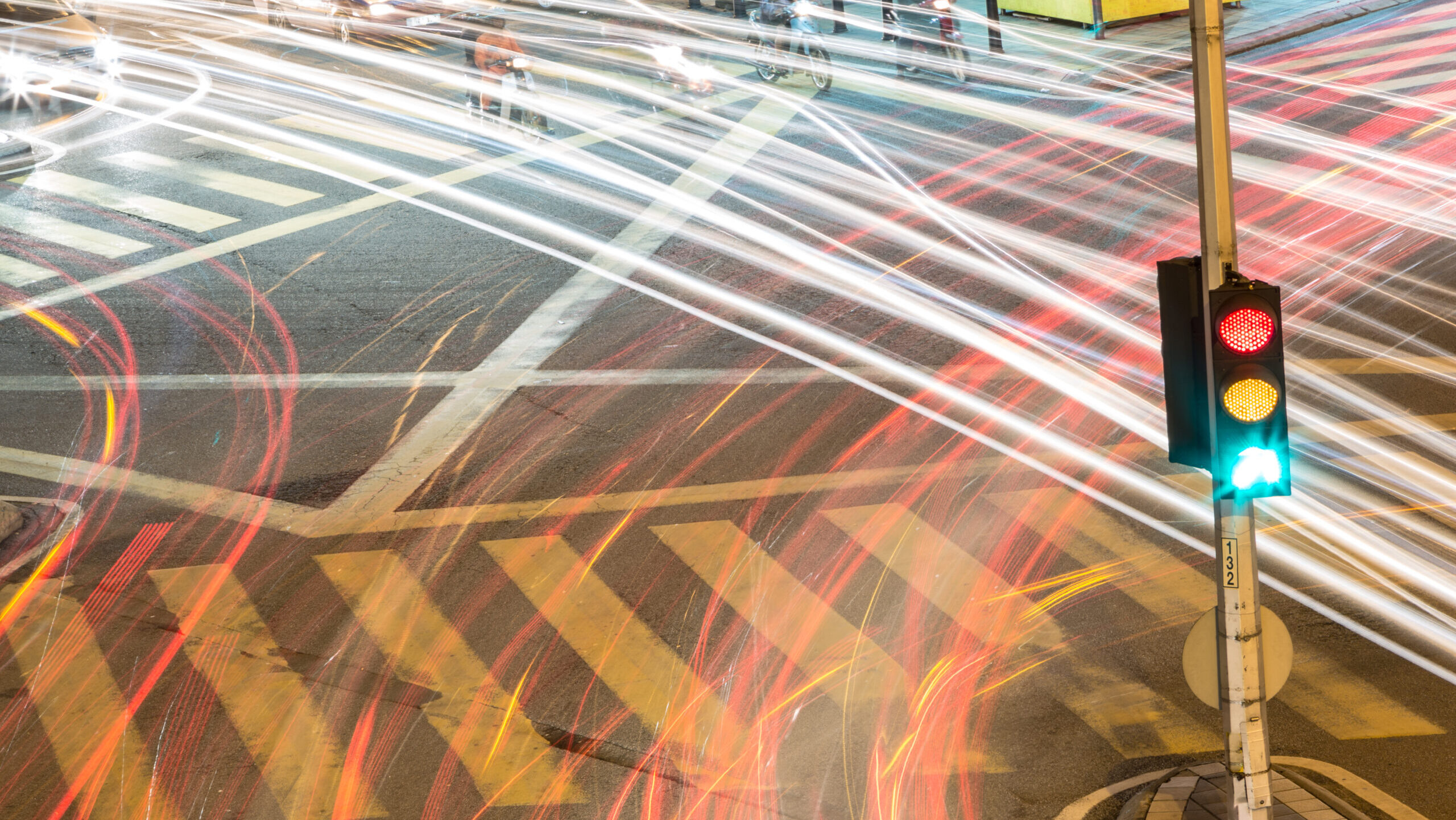 Traffic light with light streams from ongoing traffic