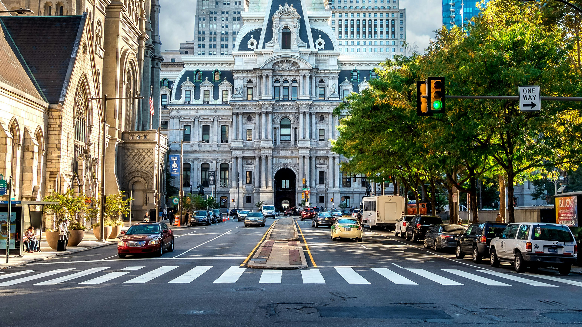 Street view of Philadelphia City Hall with blue sky in the background.