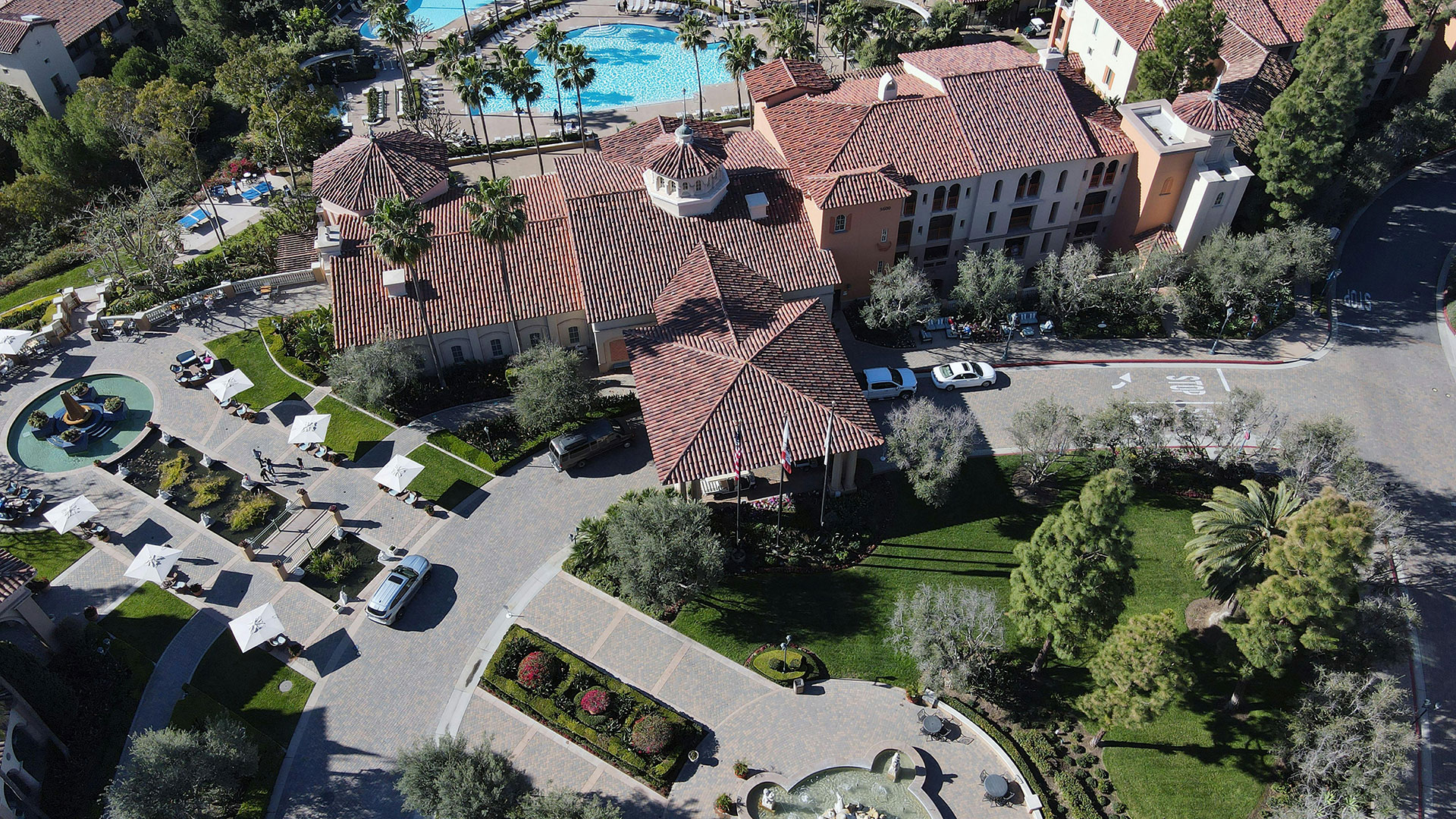 Aerial shot of resort with cars parked out front