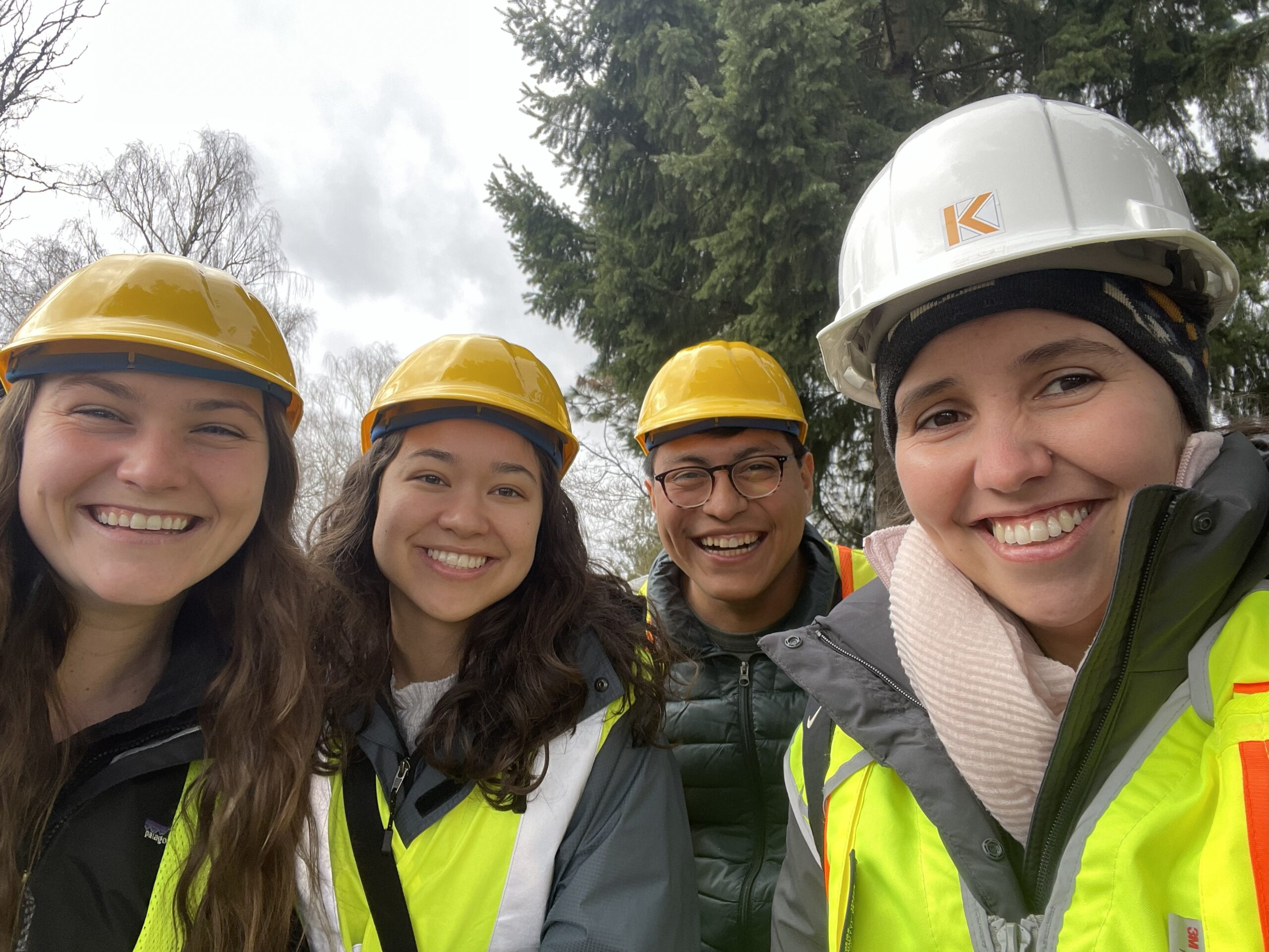 A group of people wearing hard hats.