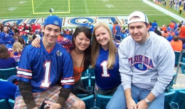 A group of people sitting in a football stadium