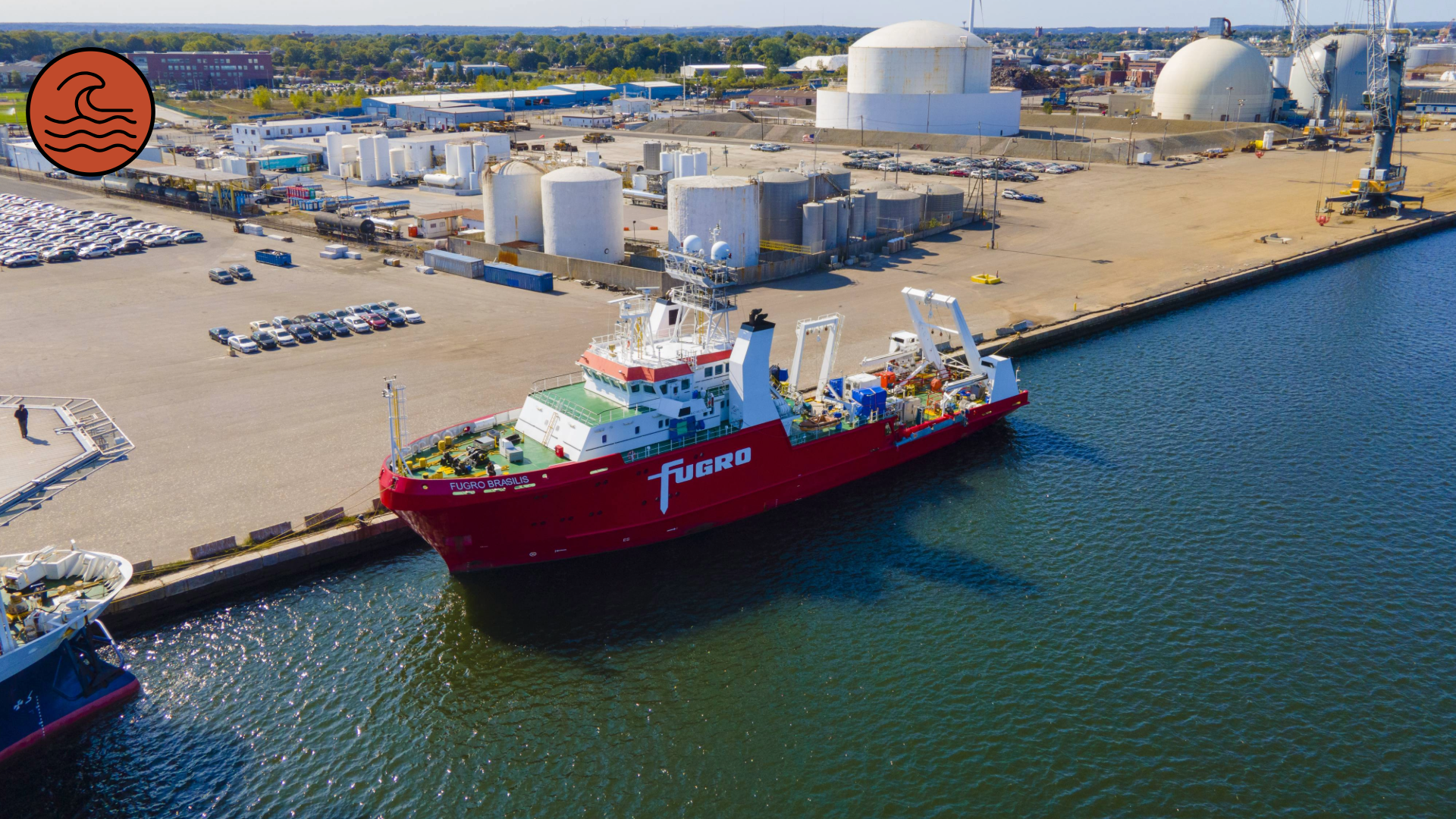 A photo of a large cargo boat docked at a port.