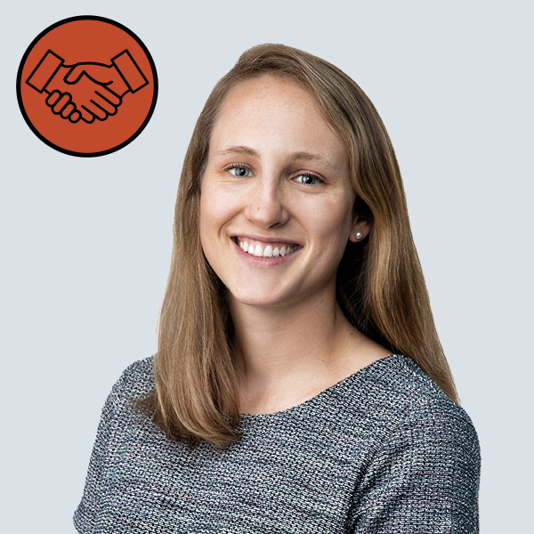 A professional headshot of a woman.